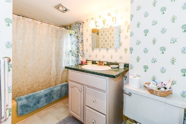21 Endicott Road Boxford, MA 01921 - Photo 18 of 30 a bathroom with a granite countertop sink and a mirror
