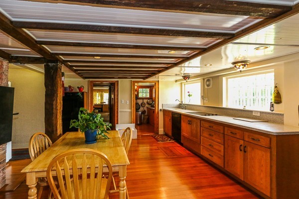21 Endicott Road Boxford, MA 01921 - Photo 2 of 30 a large white kitchen with wooden floors and stainless steel appliances