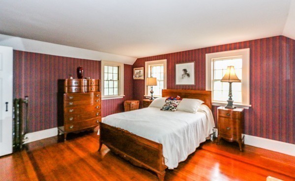 21 Endicott Road Boxford, MA 01921 - Photo 22 of 30 a bedroom with a bed and wooden floor