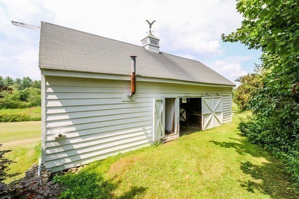 21 Endicott Road Boxford, MA 01921 - Photo 25 of 30 a view of a house with a porch and furniture
