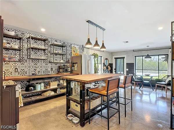 a dining room with furniture and wooden floor
