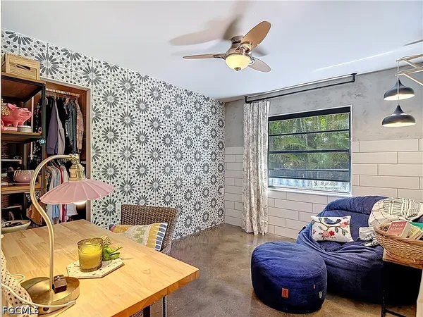 a living room with furniture and a rug