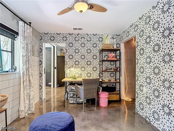 a living room with furniture and a rug