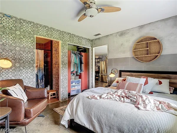 a bathroom with a toilet and a shower curtain