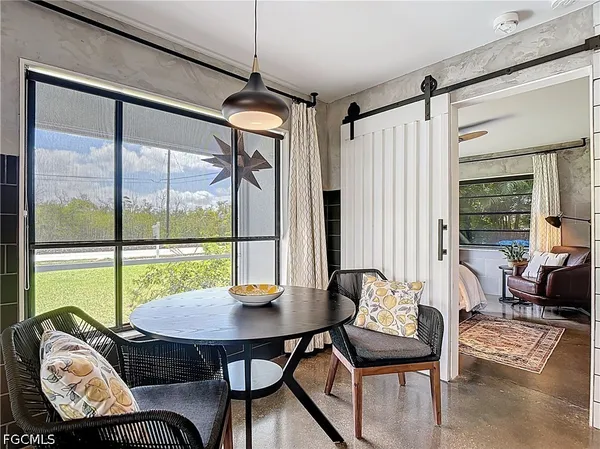 a view of a livingroom with furniture and a table