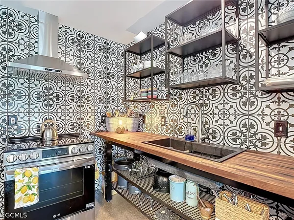 a kitchen that has a sink and a stove