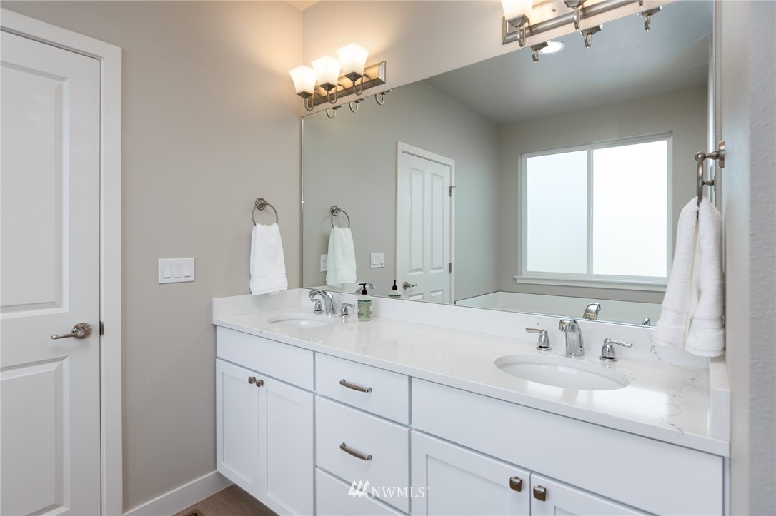 11 Lillian Ridge Court Sequim, WA 98382 - Photo 13 of 30 a bathroom with a double vanity sink and a mirror