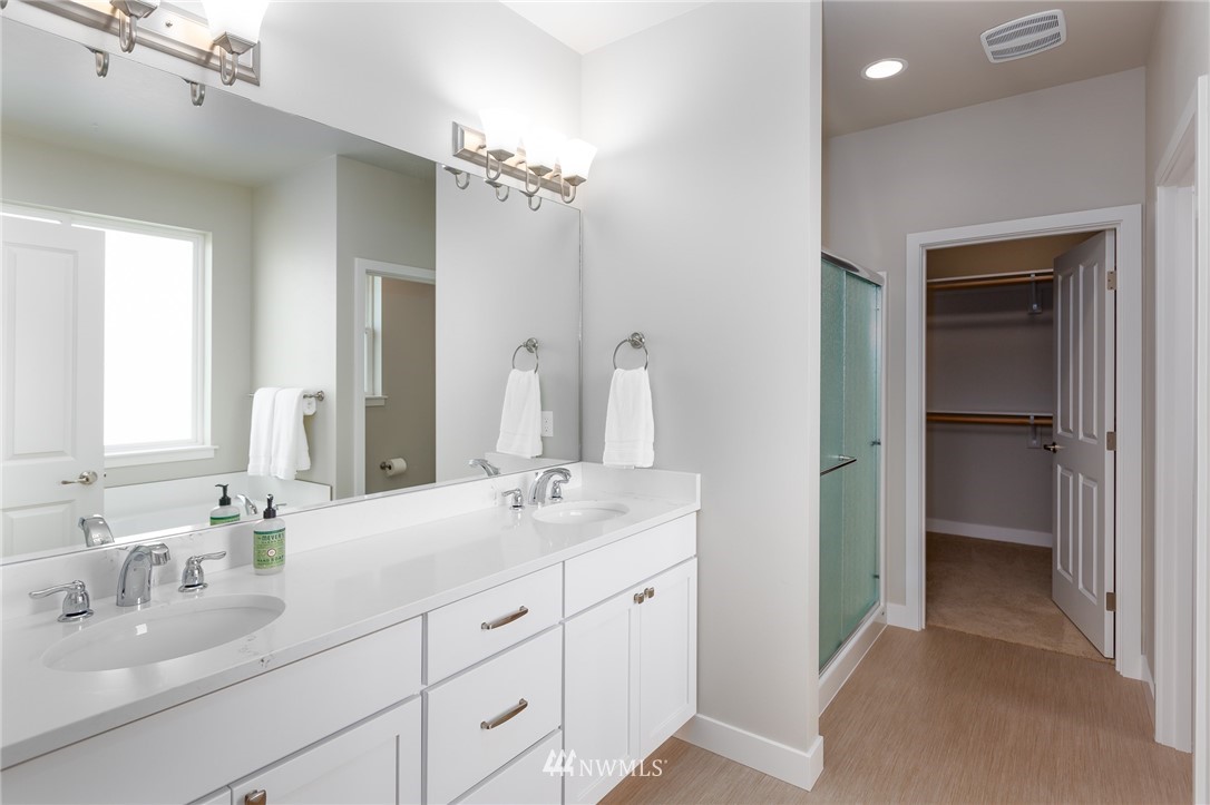 11 Lillian Ridge Court Sequim, WA 98382 - Photo 15 of 30 a bathroom with double vanity sinks and a mirror