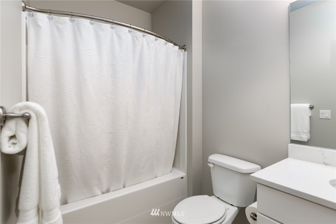 11 Lillian Ridge Court Sequim, WA 98382 - Photo 19 of 30 a white toilet sitting next to a white sink