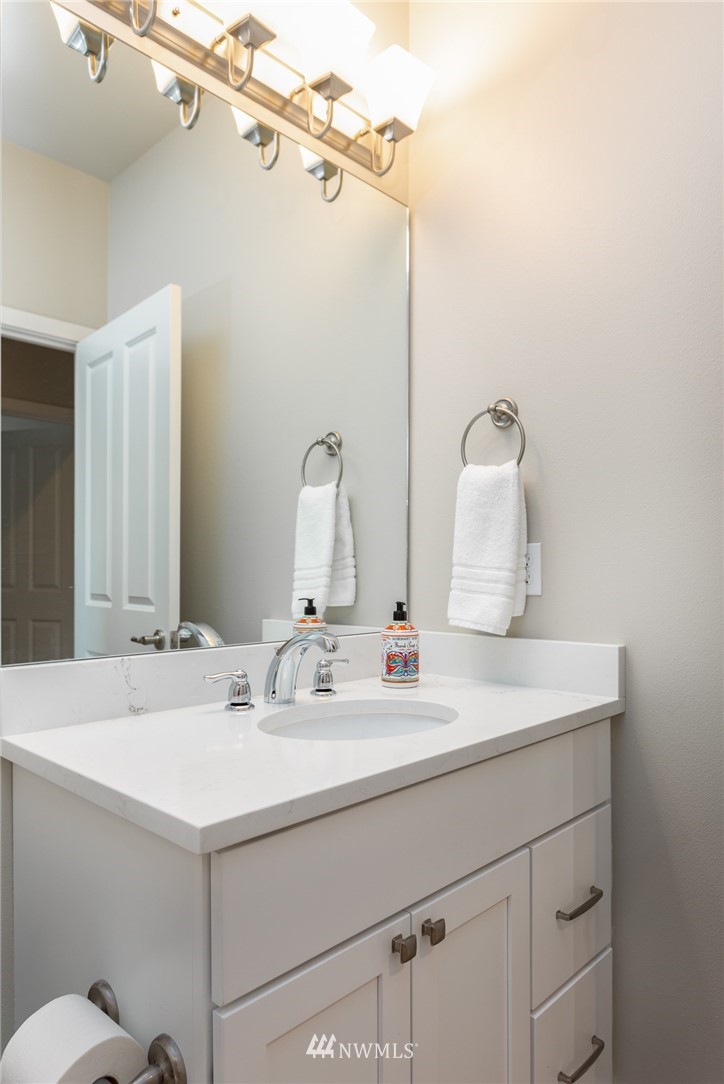 11 Lillian Ridge Court Sequim, WA 98382 - Photo 20 of 30 a bathroom with a sink and a mirror