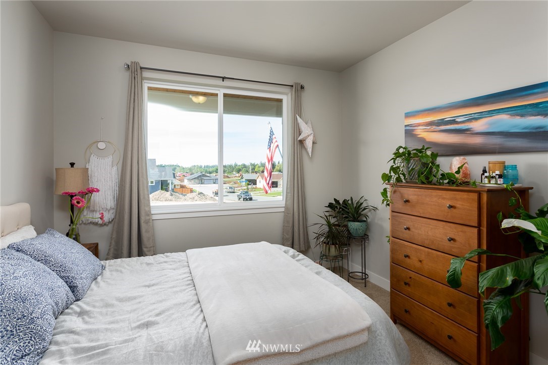 11 Lillian Ridge Court Sequim, WA 98382 - Photo 21 of 30 a bedroom with a bed and a window