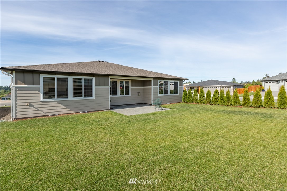 11 Lillian Ridge Court Sequim, WA 98382 - Photo 27 of 30 a front view of a house with a garden
