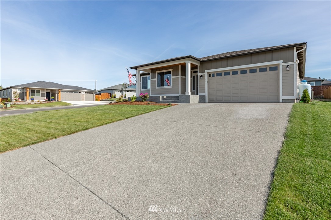 11 Lillian Ridge Court Sequim, WA 98382 - Photo 28 of 30 a front view of a house with a yard and garage