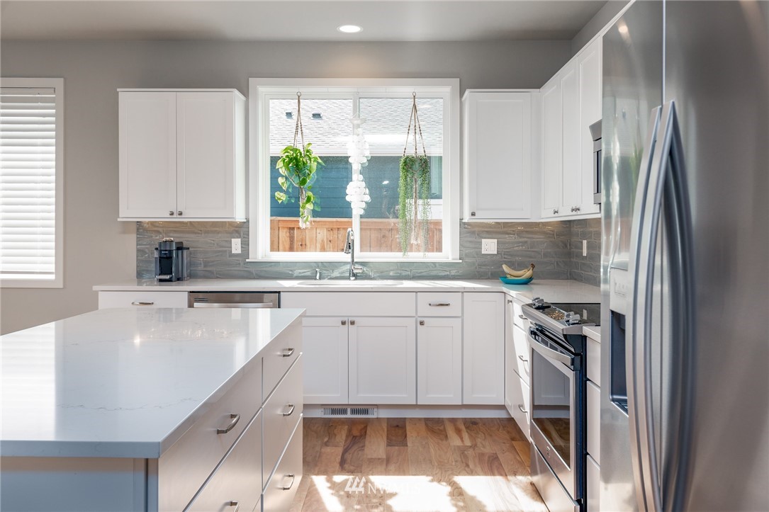 11 Lillian Ridge Court Sequim, WA 98382 - Photo 4 of 30 a kitchen with a sink appliances cabinets and a window