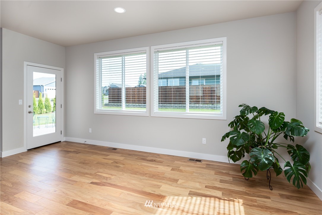 11 Lillian Ridge Court Sequim, WA 98382 - Photo 7 of 30 a view of an empty room with wooden floor and a window