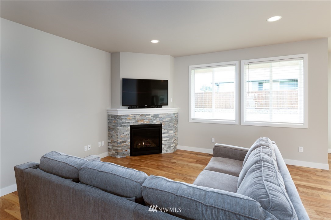 11 Lillian Ridge Court Sequim, WA 98382 - Photo 10 of 30 a living room with furniture or couch and a fireplace