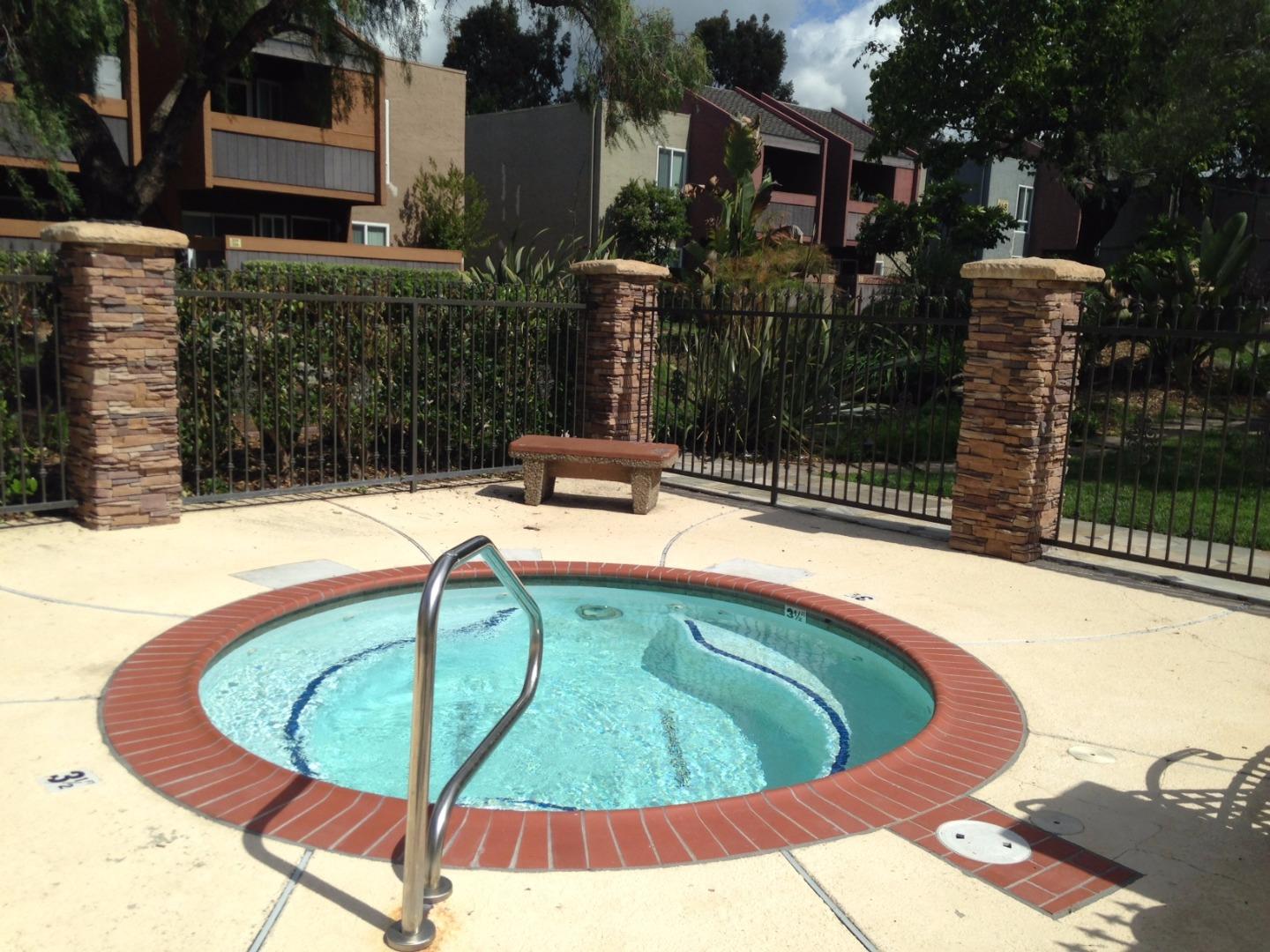 464 Dempsey Road, Unit 265 Milpitas, CA 95035 - Photo 11 of 15 a view of a swimming pool with a patio