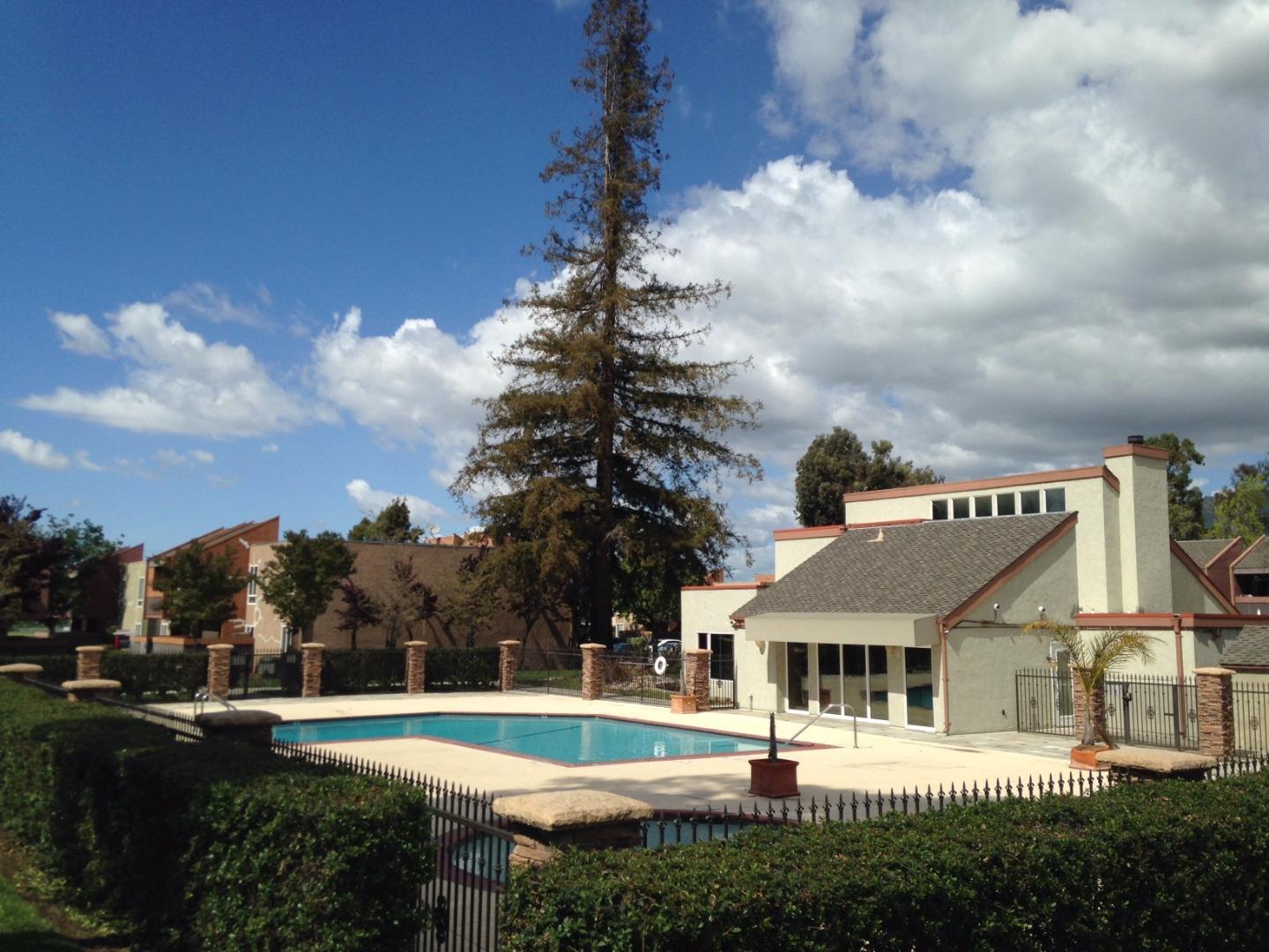 464 Dempsey Road, Unit 265 Milpitas, CA 95035 - Photo 13 of 15 a view of an house with swimming pool garden and trees