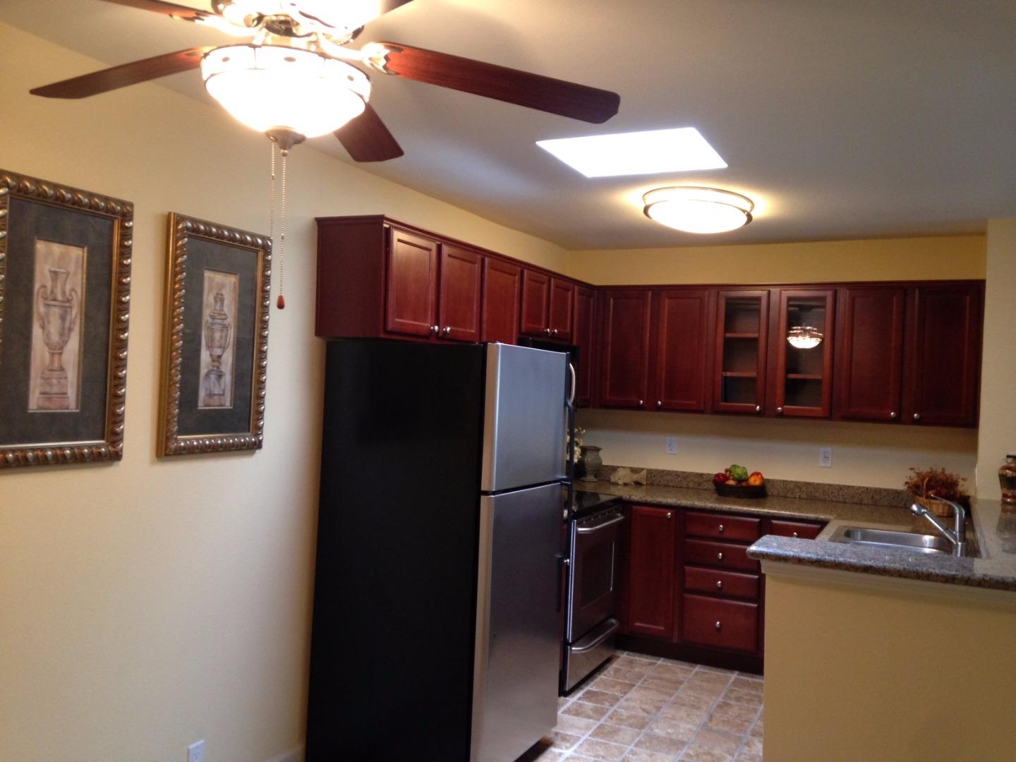 464 Dempsey Road, Unit 265 Milpitas, CA 95035 - Photo 5 of 15 a kitchen with a refrigerator and a sink