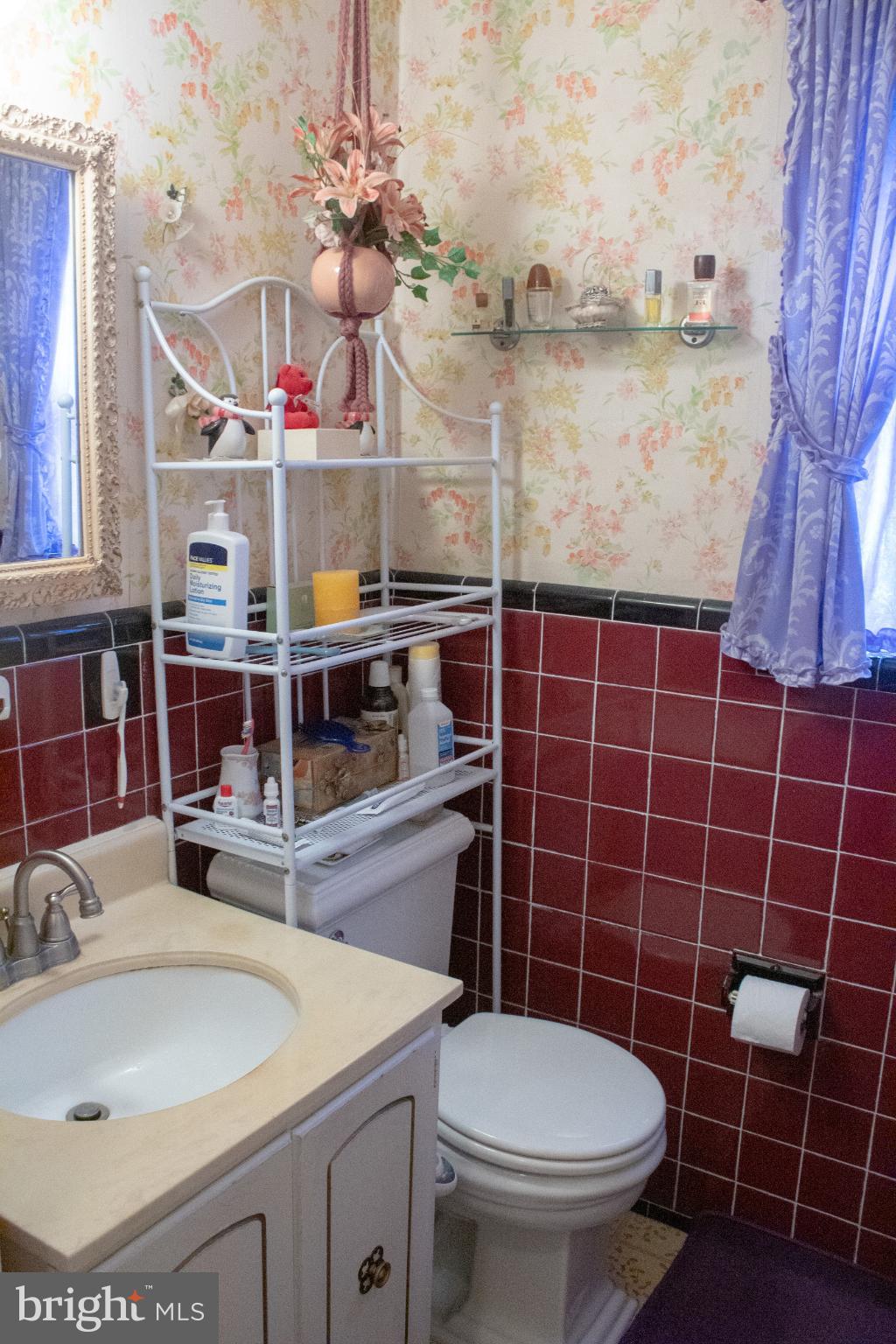526 South Carlin Springs Road Arlington, VA 22204 - Photo 12 of 33 a bathroom with a sink a toilet and a mirror
