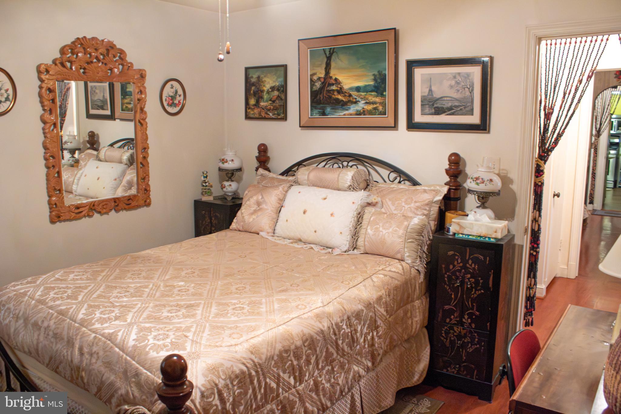 526 South Carlin Springs Road Arlington, VA 22204 - Photo 16 of 33 a bedroom with a bed and a painting on the wall