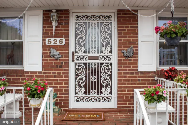 a view of front door with outdoor seating