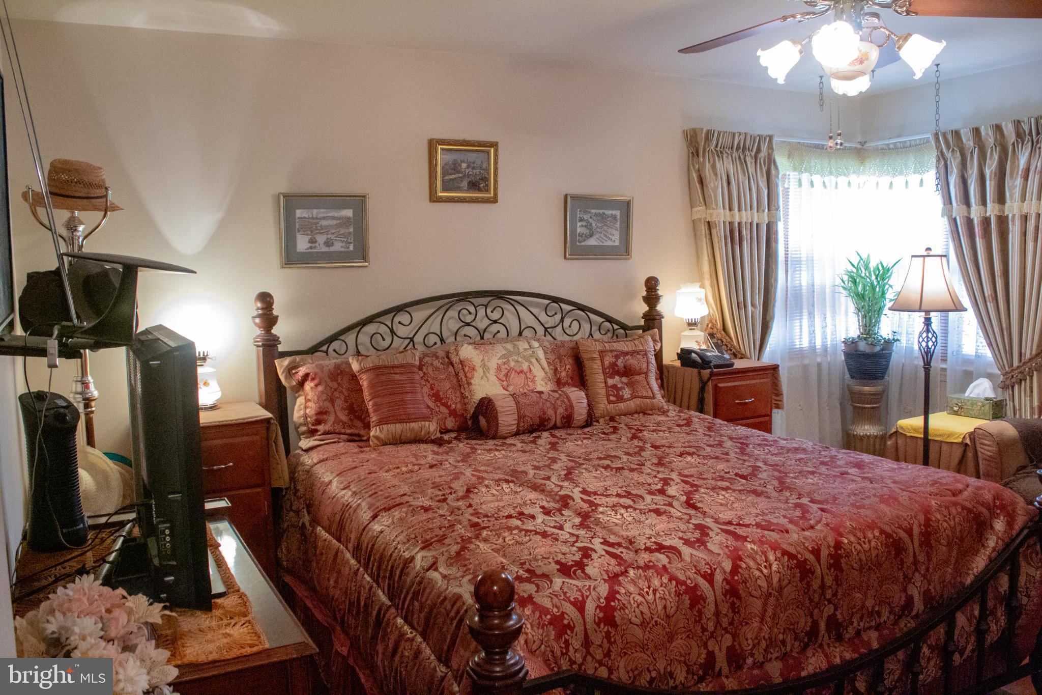 526 South Carlin Springs Road Arlington, VA 22204 - Photo 28 of 33 a bedroom with a large bed and a chandelier