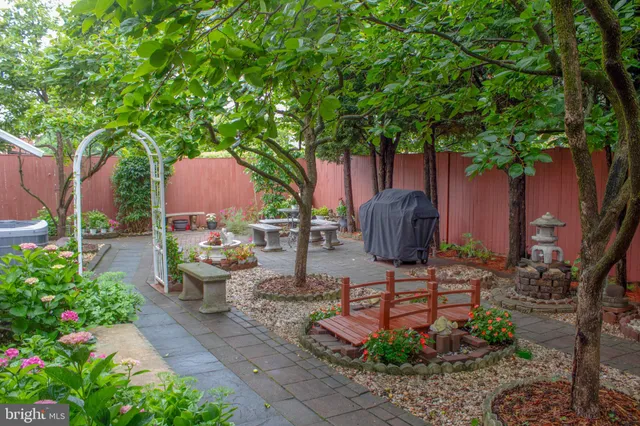 a view of a pathway with a backyard