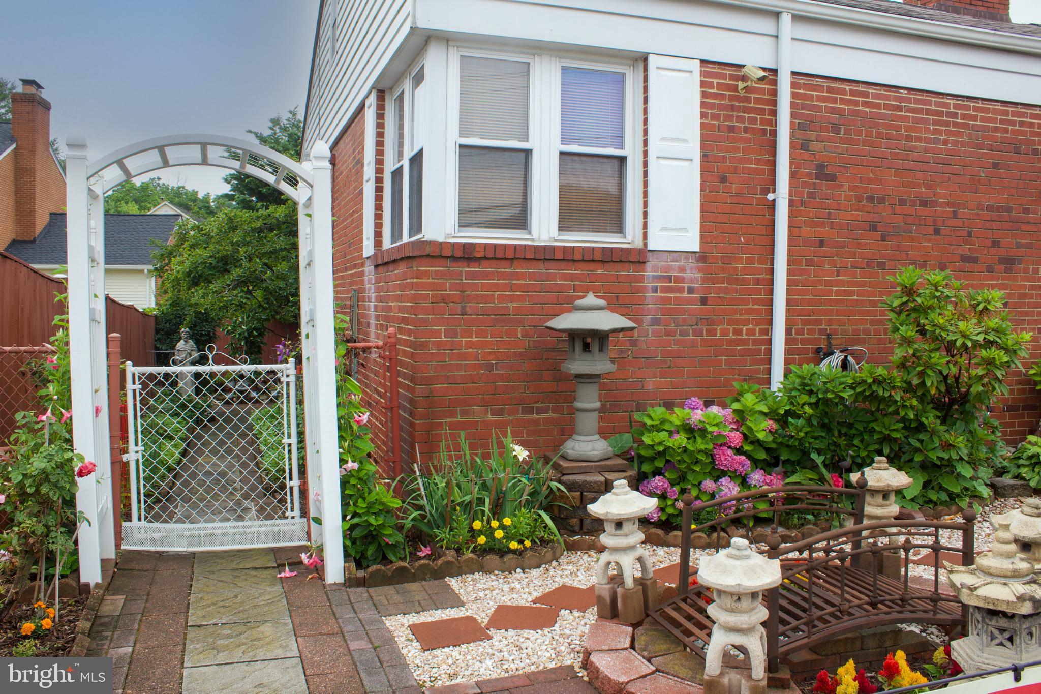 526 South Carlin Springs Road Arlington, VA 22204 - Photo 8 of 33 a view of a potted plant sitting in front of a house