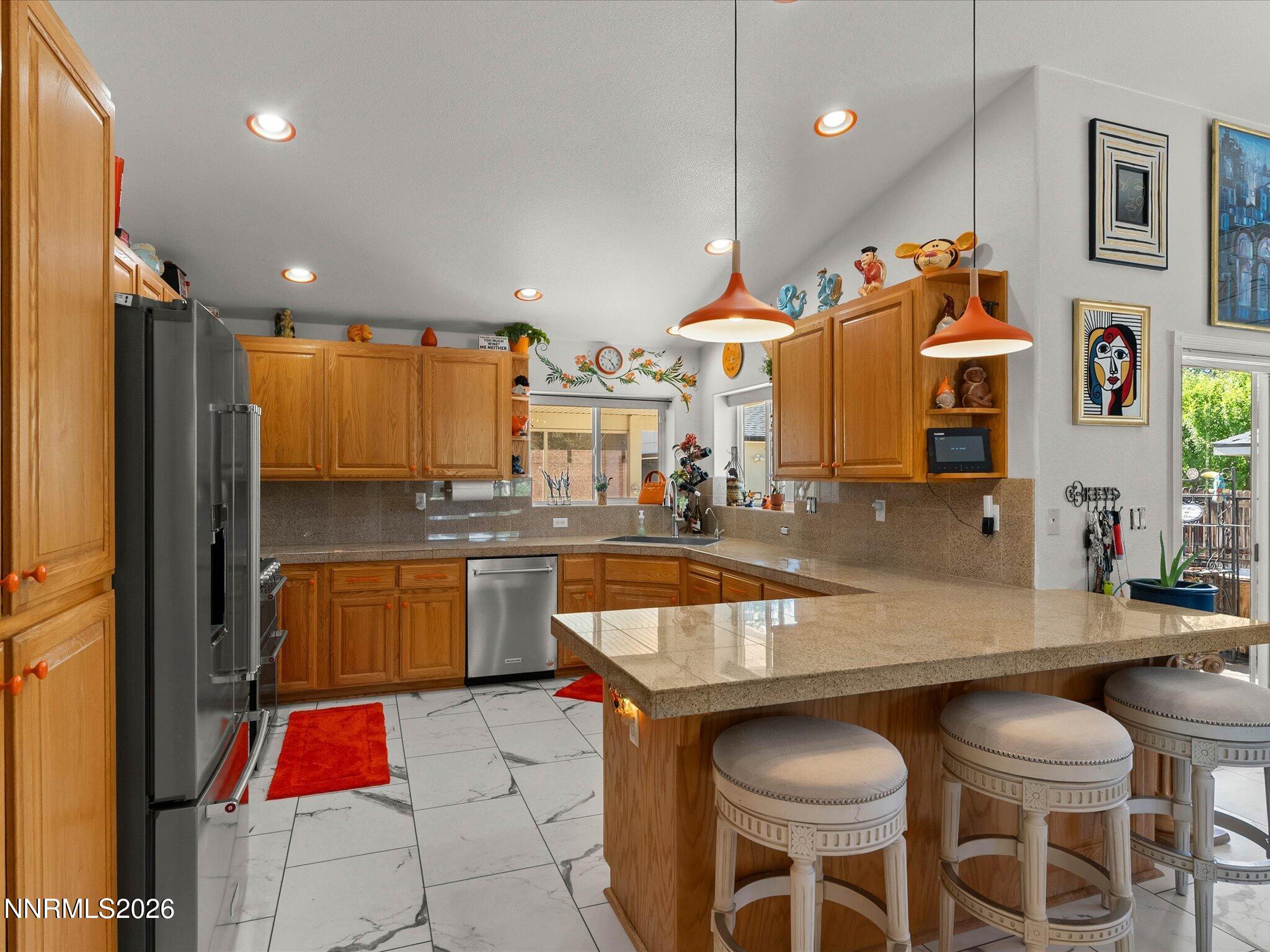 1080 Red Rock Road Fernley, NV 89408 - Photo 15 of 45 a kitchen with stainless steel appliances granite countertop a sink and refrigerator