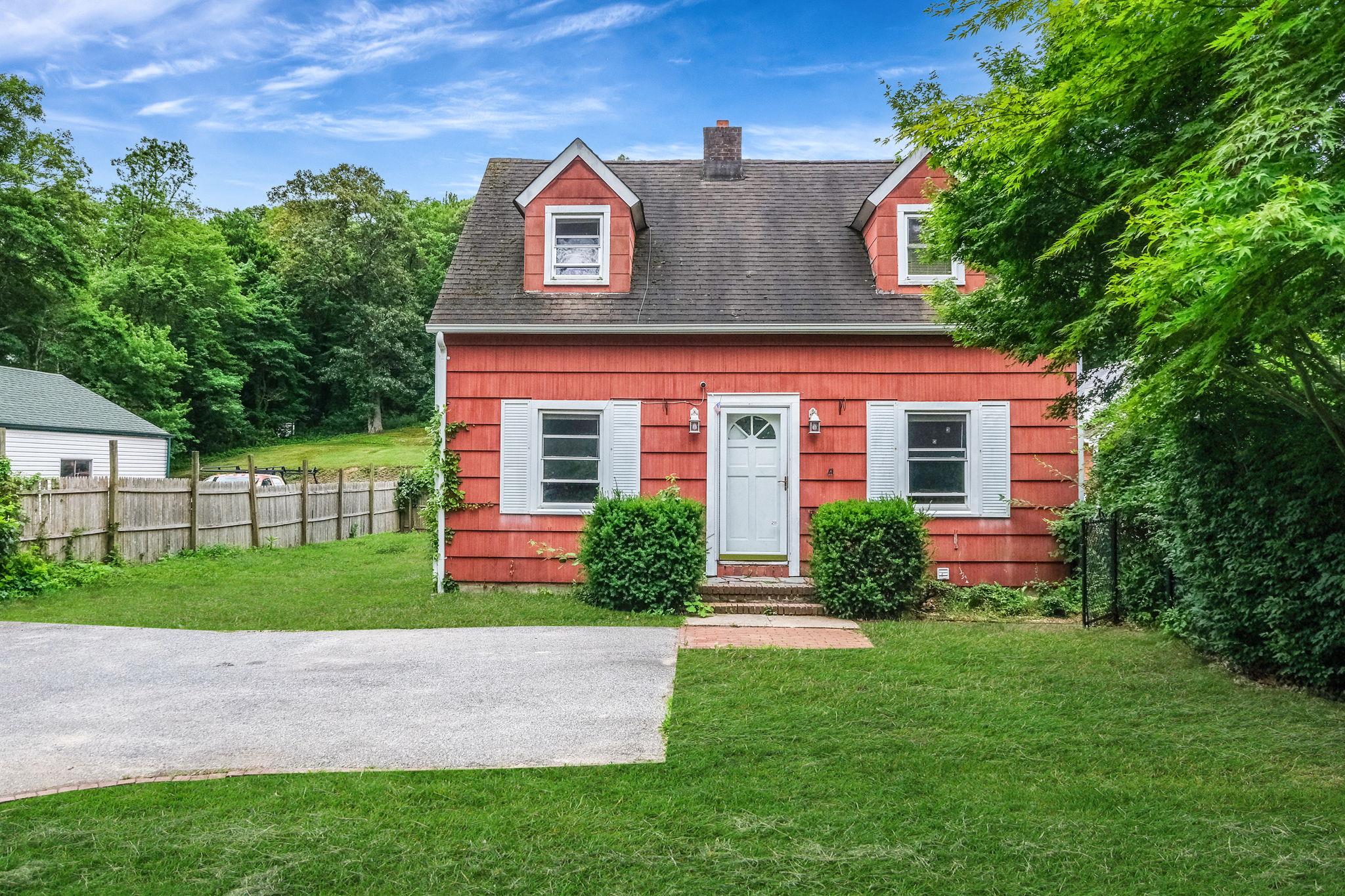 36 Daly Road East Northport, NY 11731 - Photo 1 of 1 a front view of a house with a garden and plants