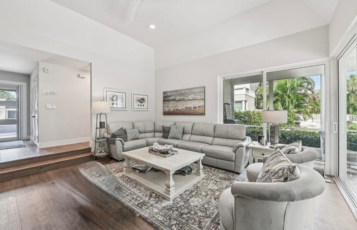 660 Forsyth Street, Unit 7 Boca Raton, FL 33487 - Photo 12 of 27 a living room with furniture a rug and a large window
