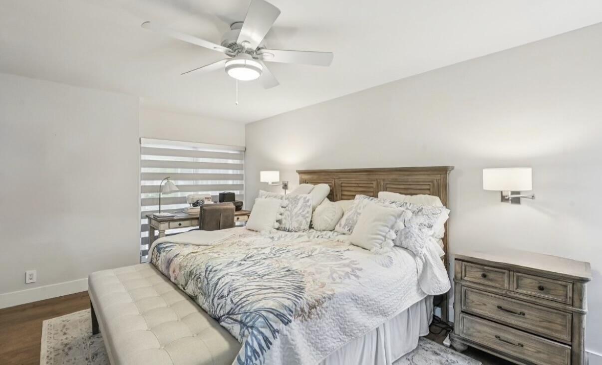 660 Forsyth Street, Unit 7 Boca Raton, FL 33487 - Photo 14 of 27 a bedroom with a bed and a chandelier