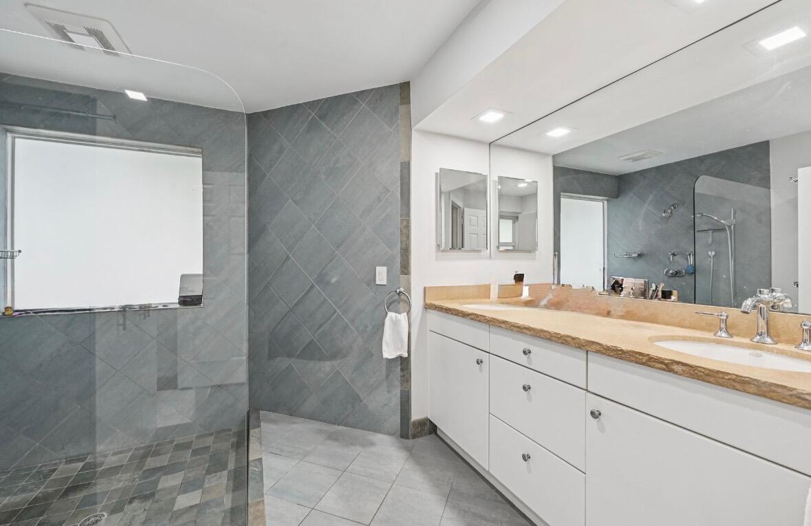 660 Forsyth Street, Unit 7 Boca Raton, FL 33487 - Photo 15 of 27 a spacious bathroom with a granite countertop sink mirror and double