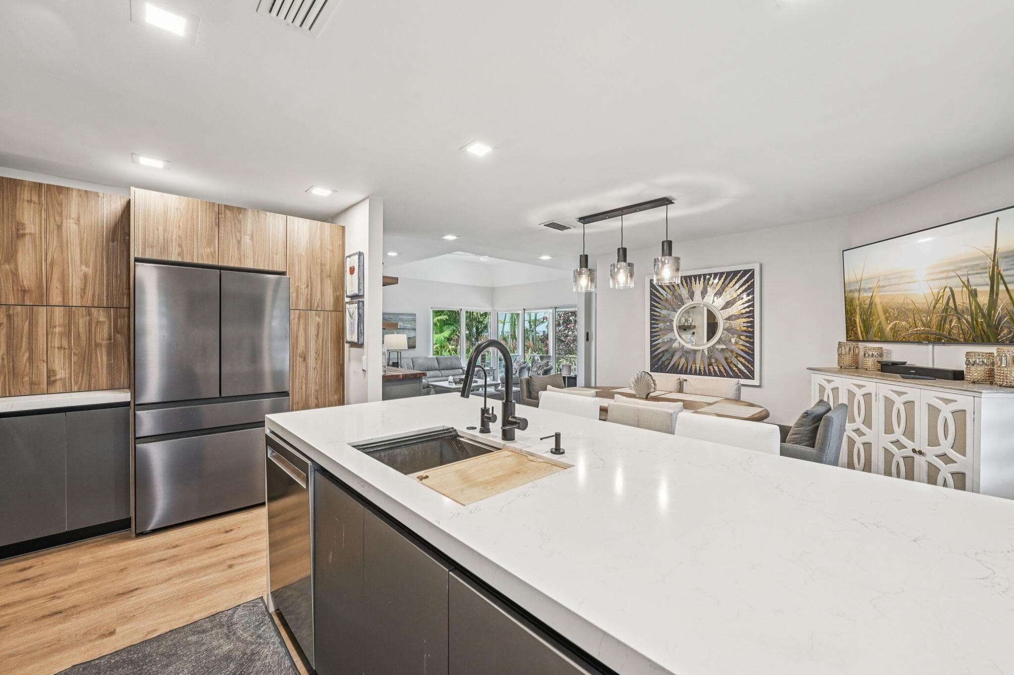 660 Forsyth Street, Unit 7 Boca Raton, FL 33487 - Photo 5 of 27 a kitchen with stainless steel appliances a sink and a refrigerator