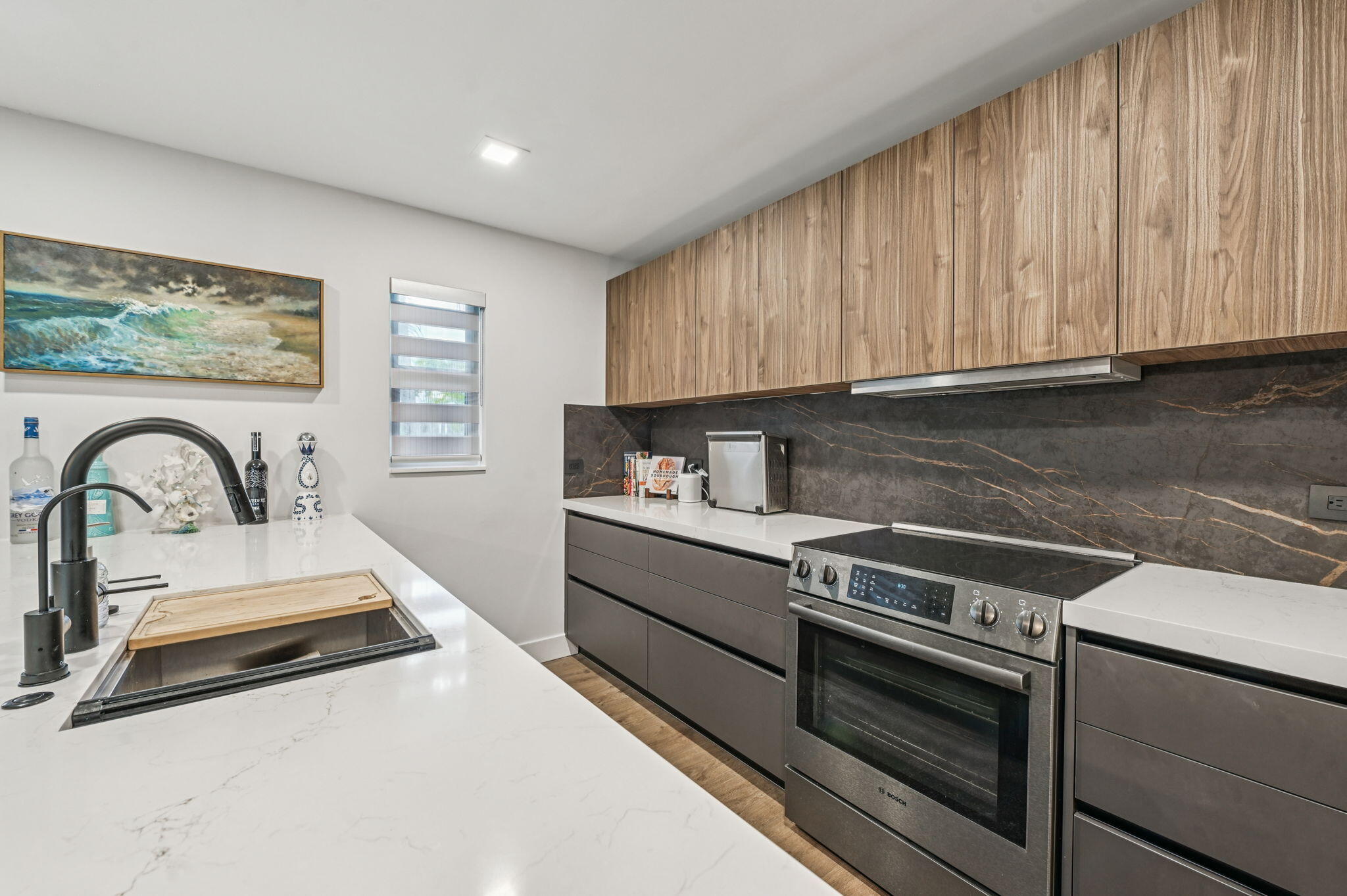 660 Forsyth Street, Unit 7 Boca Raton, FL 33487 - Photo 7 of 27 a kitchen with a stove and a white cabinets