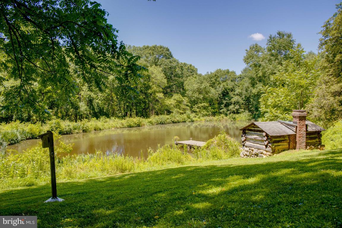 1201 Gold Mine Road Brookeville, MD 20833 - Photo 42 of 61 View of the pond with the dock and Sauna House