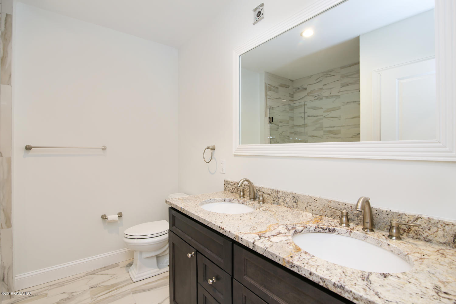 8 Sound Beach Ave Extension, Unit 4 Riverside, CT 06878 - Photo 13 of 25 a bathroom with a granite countertop sink a toilet and a mirror