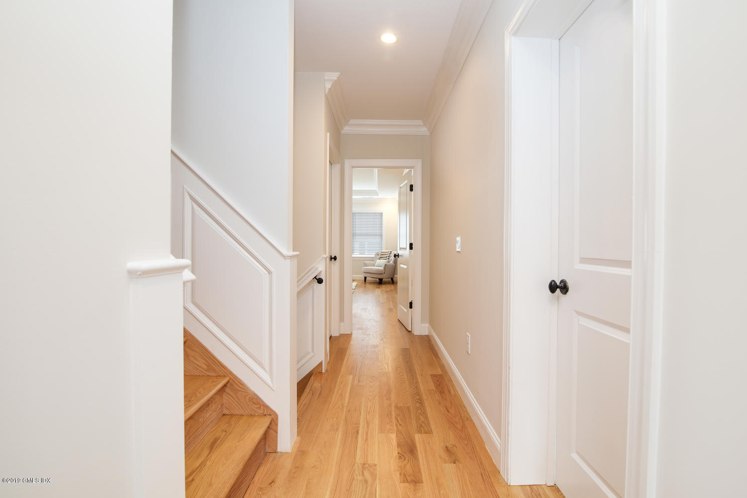 8 Sound Beach Ave Extension, Unit 4 Riverside, CT 06878 - Photo 16 of 25 a view of a hallway with wooden floor and staircase