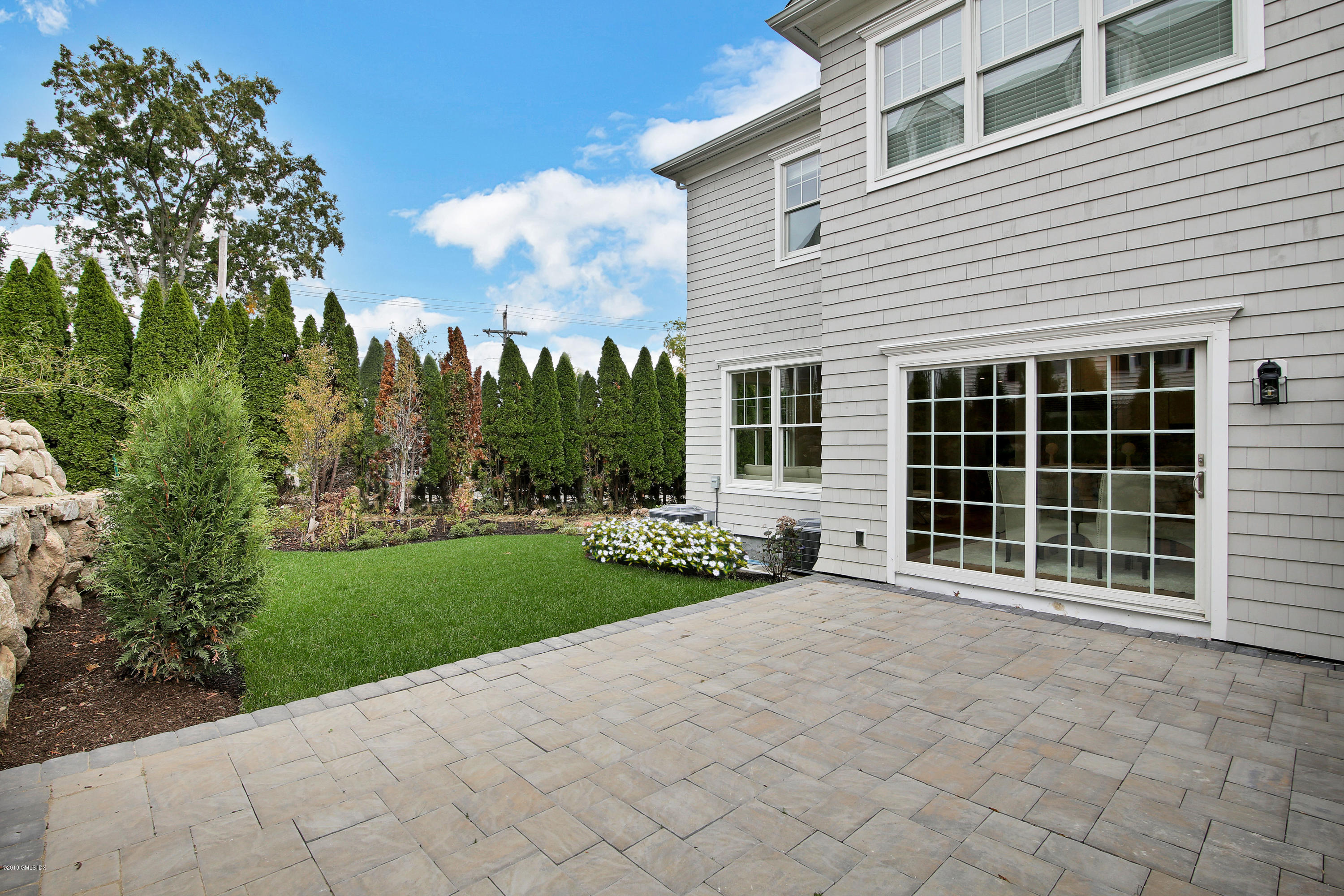 8 Sound Beach Ave Extension, Unit 4 Riverside, CT 06878 - Photo 21 of 25 a view of a house with yard and a garden