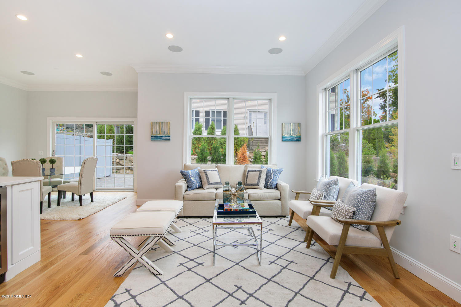 8 Sound Beach Ave Extension, Unit 4 Riverside, CT 06878 - Photo 3 of 25 a living room with furniture and large windows