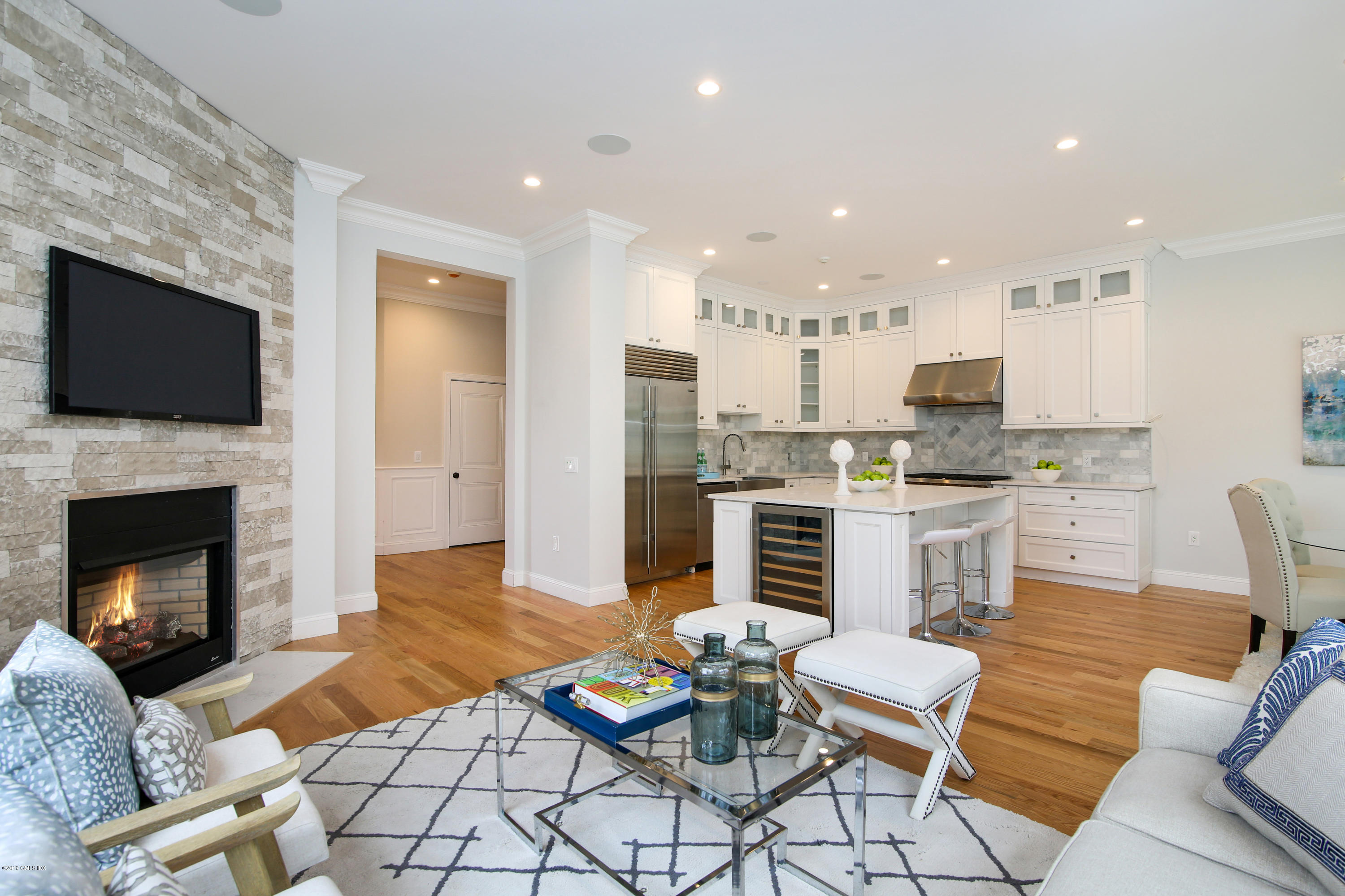 8 Sound Beach Ave Extension, Unit 4 Riverside, CT 06878 - Photo 4 of 25 a living room with furniture and a fireplace