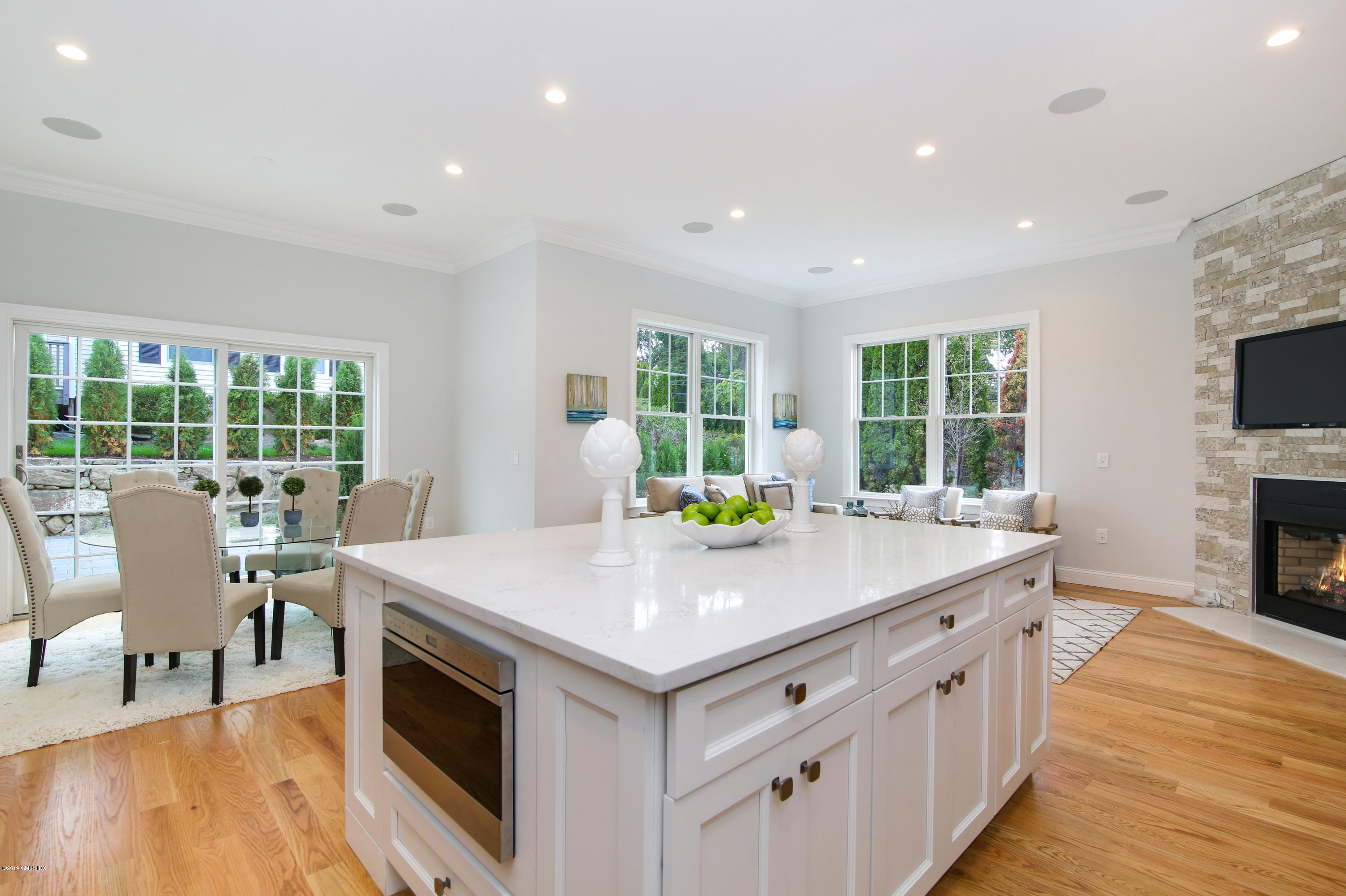 8 Sound Beach Ave Extension, Unit 4 Riverside, CT 06878 - Photo 5 of 25 a room with furniture wooden floor and a fireplace
