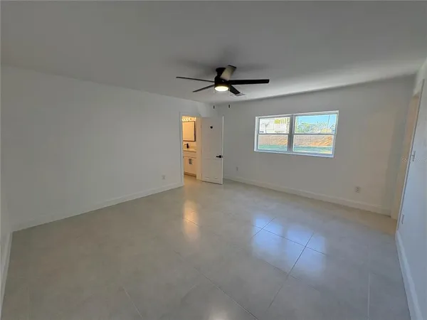 a view of an empty room with a window