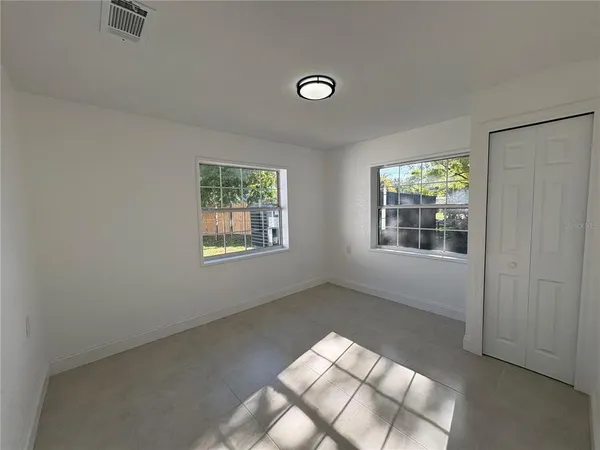 an empty room with windows