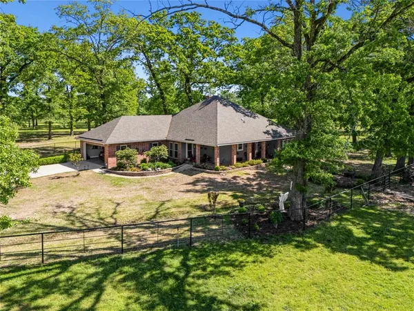 a house with trees in the background
