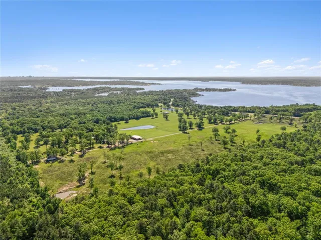 a view of a big yard with lots of green space