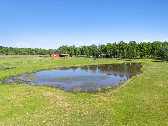 a view of a lake with houses in the back