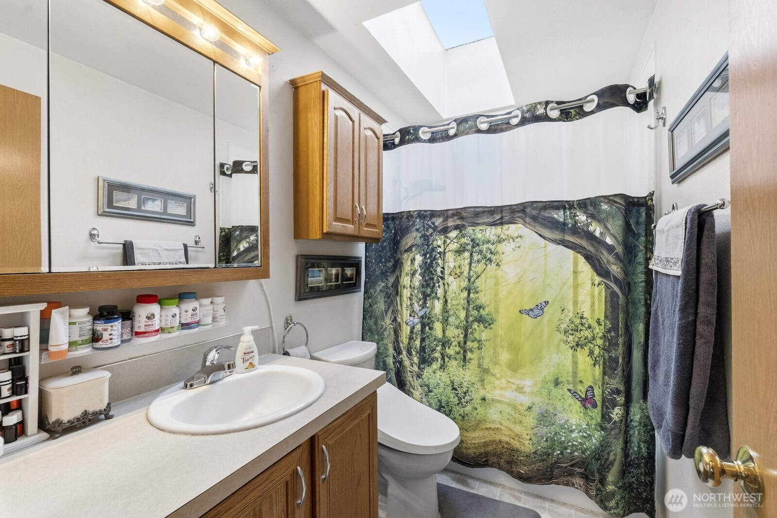 237 167th Street South Spanaway, WA 98387 - Photo 16 of 30 a bathroom with a sink toilet and shower