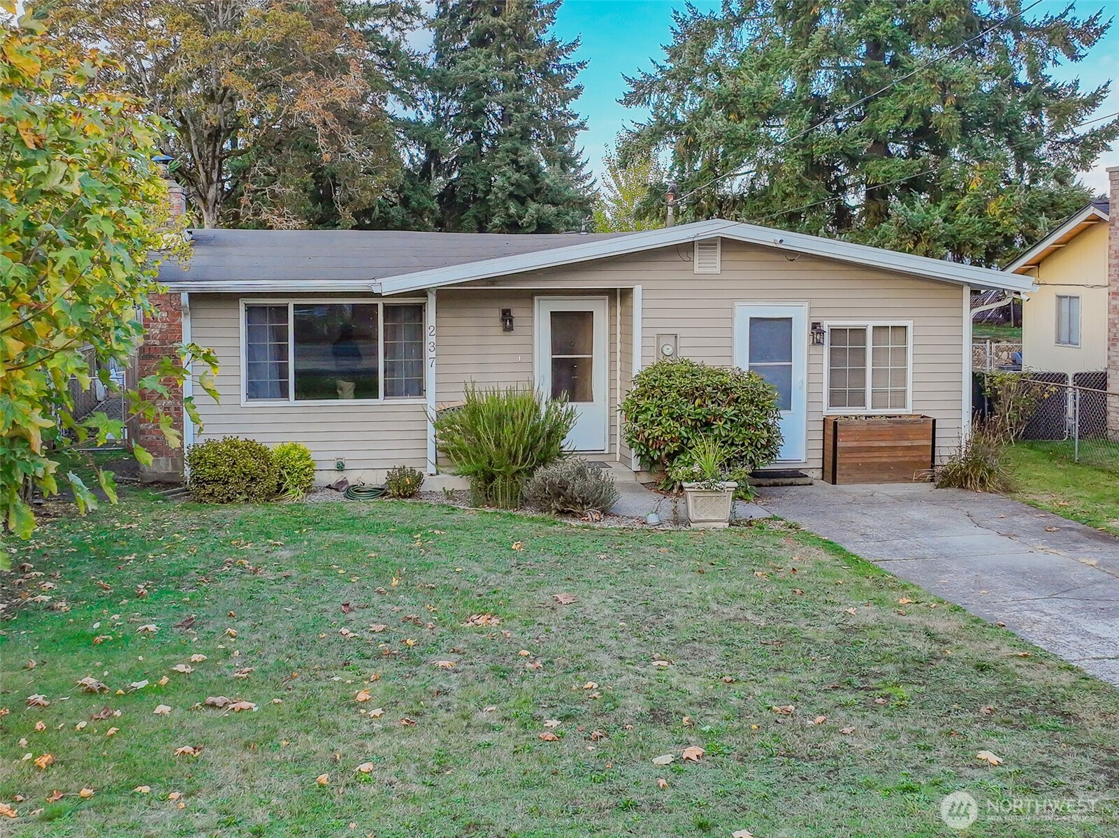 237 167th Street South Spanaway, WA 98387 - Photo 2 of 30 a view of a house with a yard and potted plants